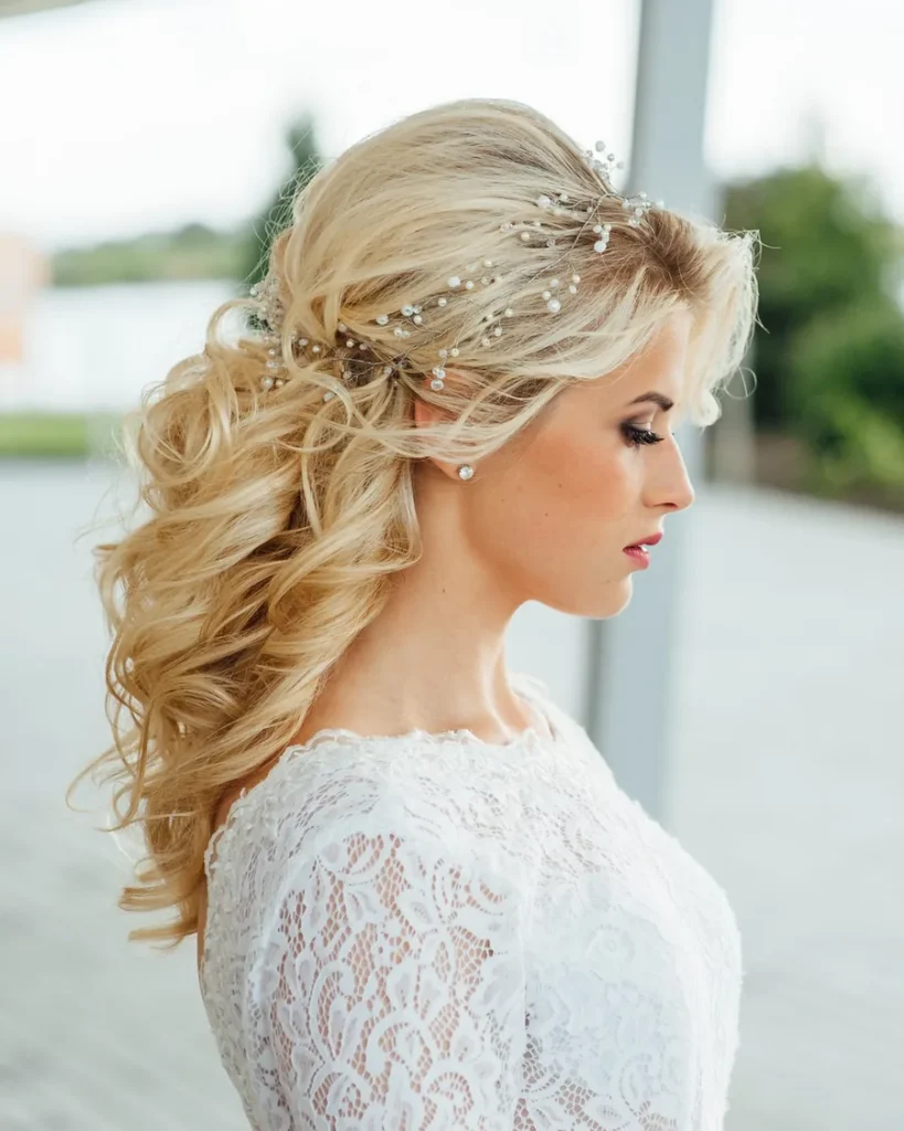 Side-swept bridal curls with a pearl hair vine and lace gown, LaBara Salon Buckhead Atlanta